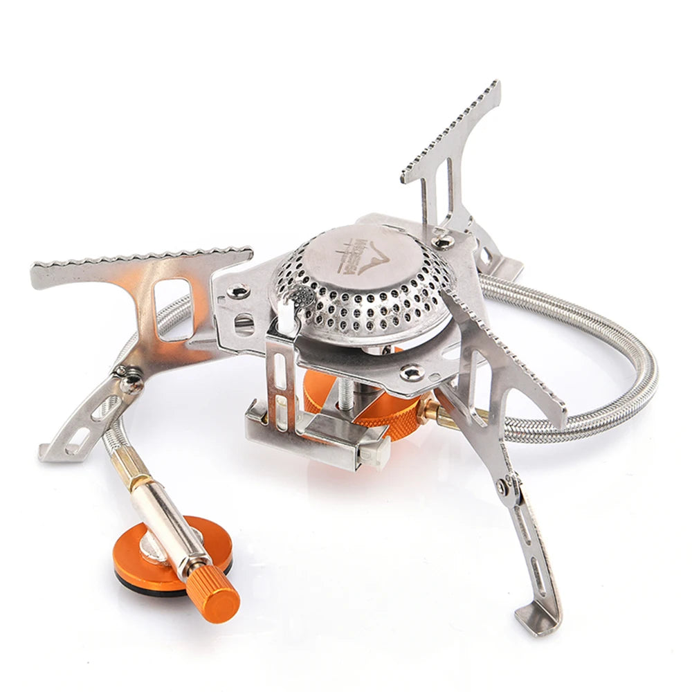 Portable camping stove with orange accents on a white background