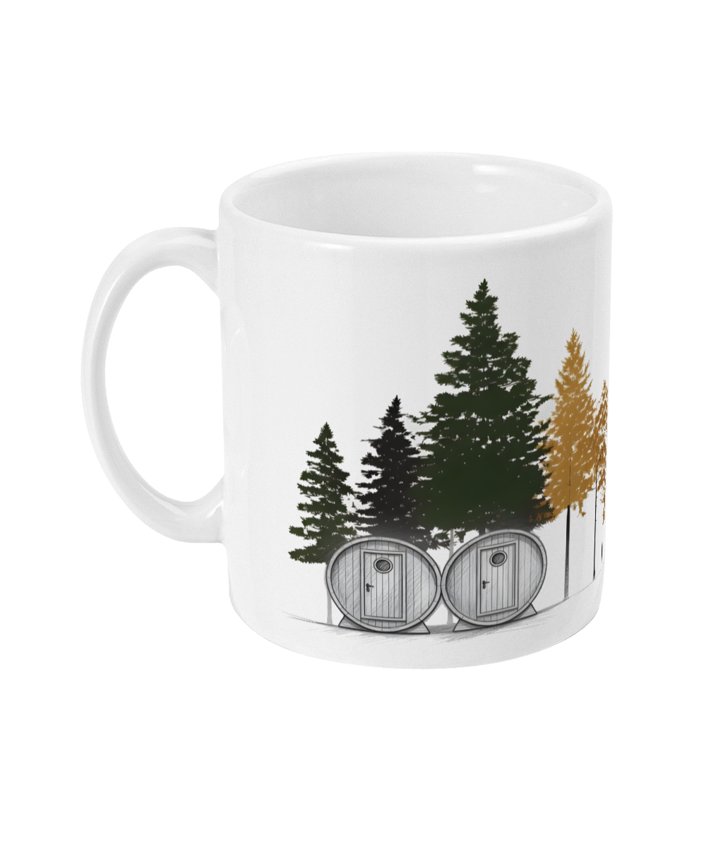 White mug with forest design featuring trees and cabins on a white background