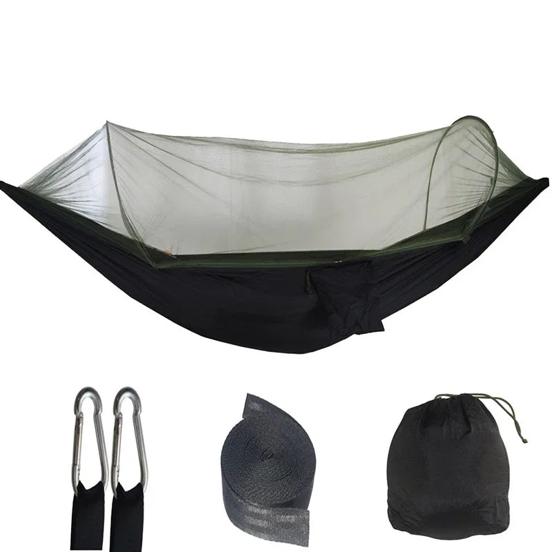 Hammock set with carrying bag, carabiners, and mesh cover on a white background