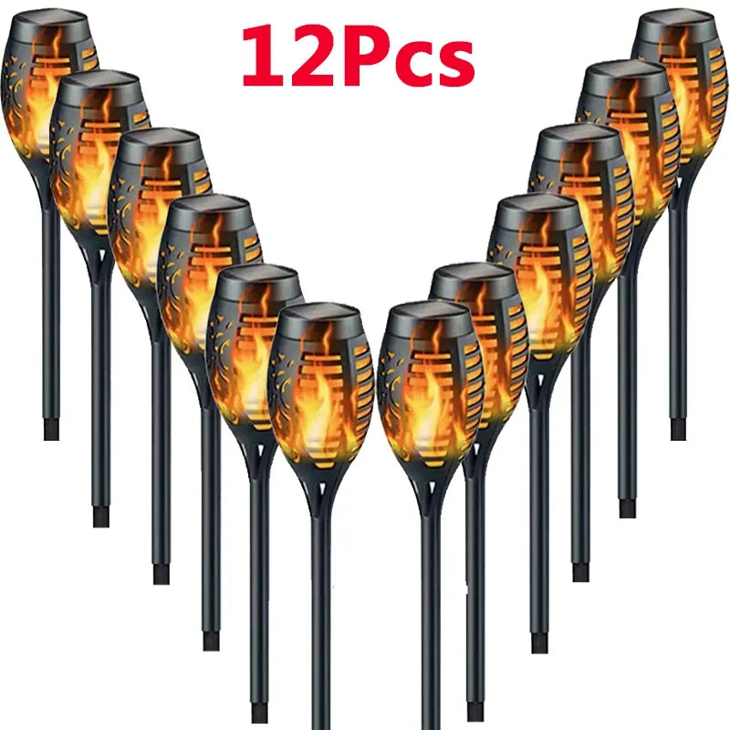 12 solar-powered flame lights on a white background with '12Pcs' text above.