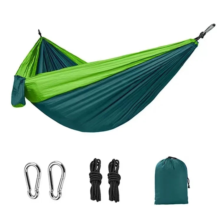 Green and blue hammock with accessories on a white background