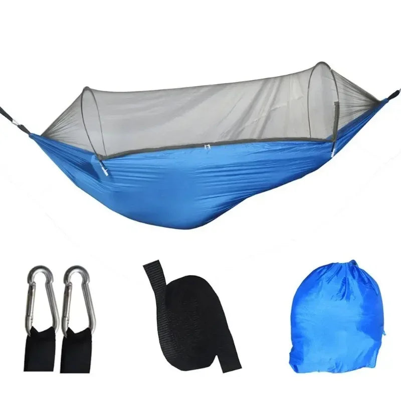 Blue camping hammock with accessories on a white background