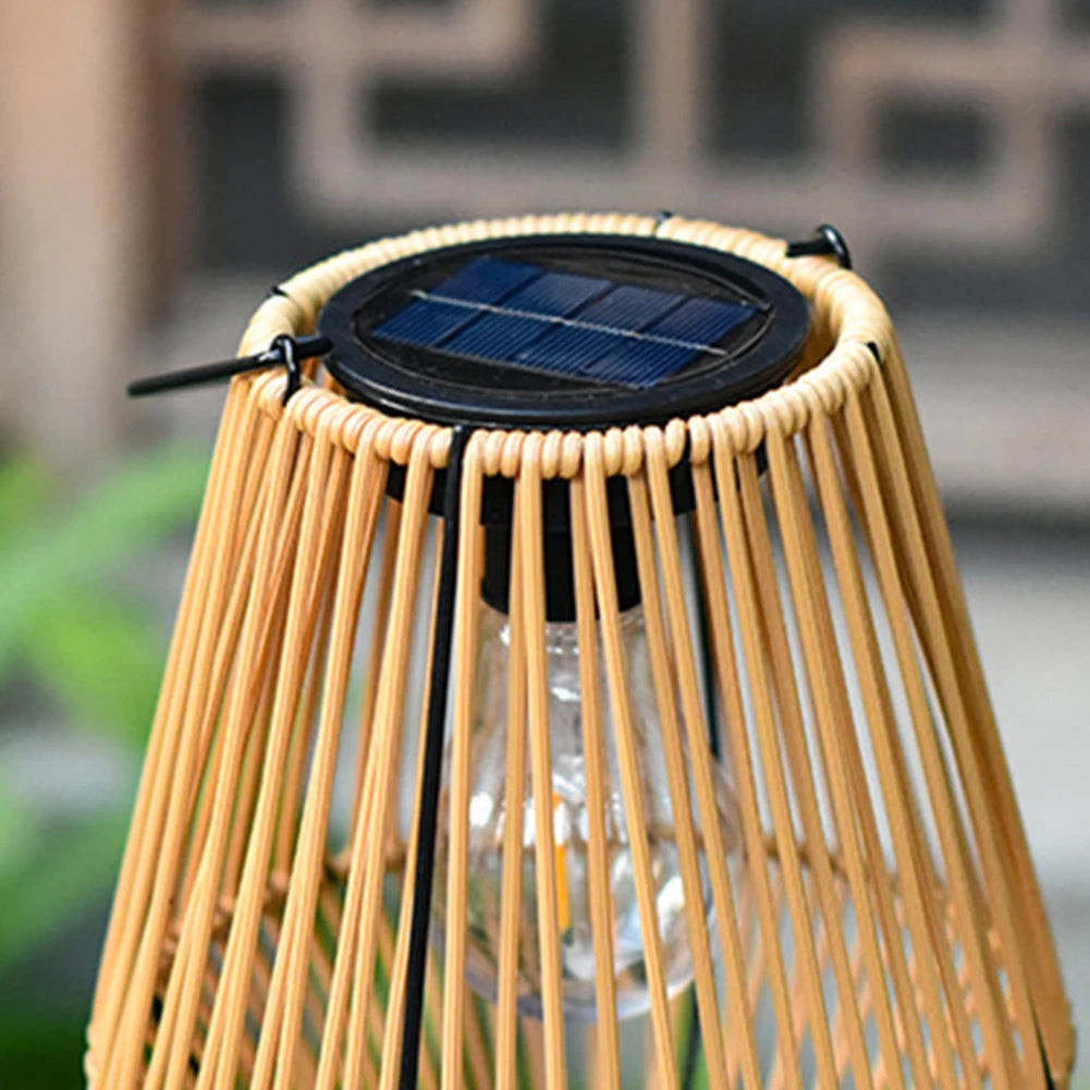 Wicker outdoor lamp with solar panel on top