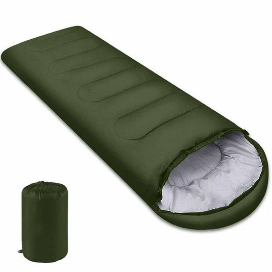 Green sleeping bag with white interior on a white background