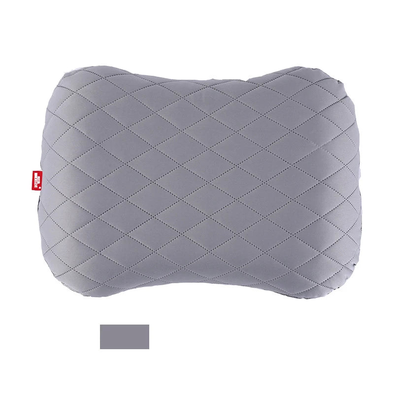 Gray quilted headrest cover on a white background