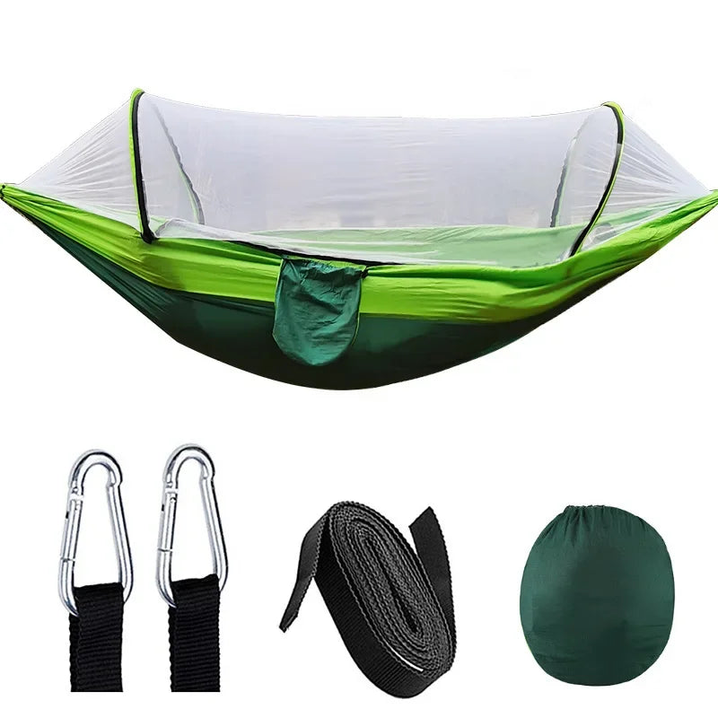 Green camping hammock with accessories on a white background