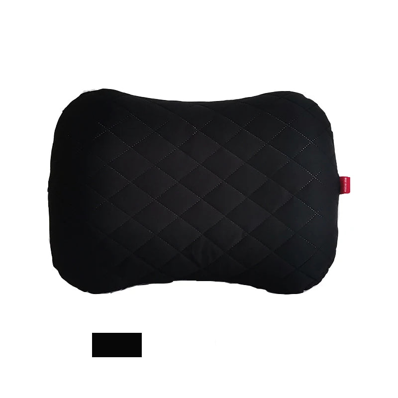 Black quilted travel pillow on a white background