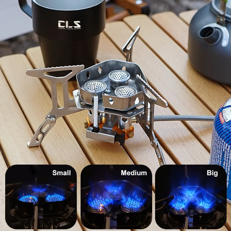 Portable gas stove on a wooden surface with flame size indicators.