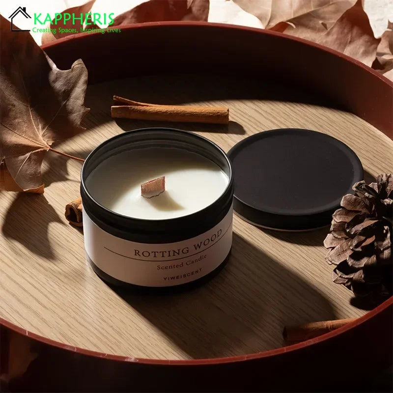 Scented candle labeled 'Rotting Wood' by KAPPHARIS on a wooden surface with leaves and cinnamon sticks.