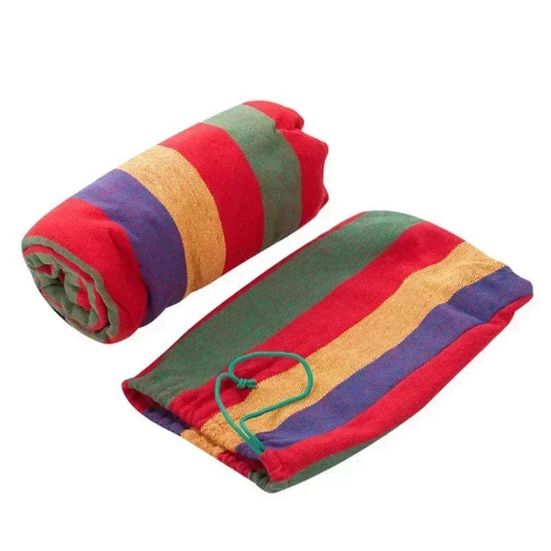 Colorful striped towel with a green clip on a white background