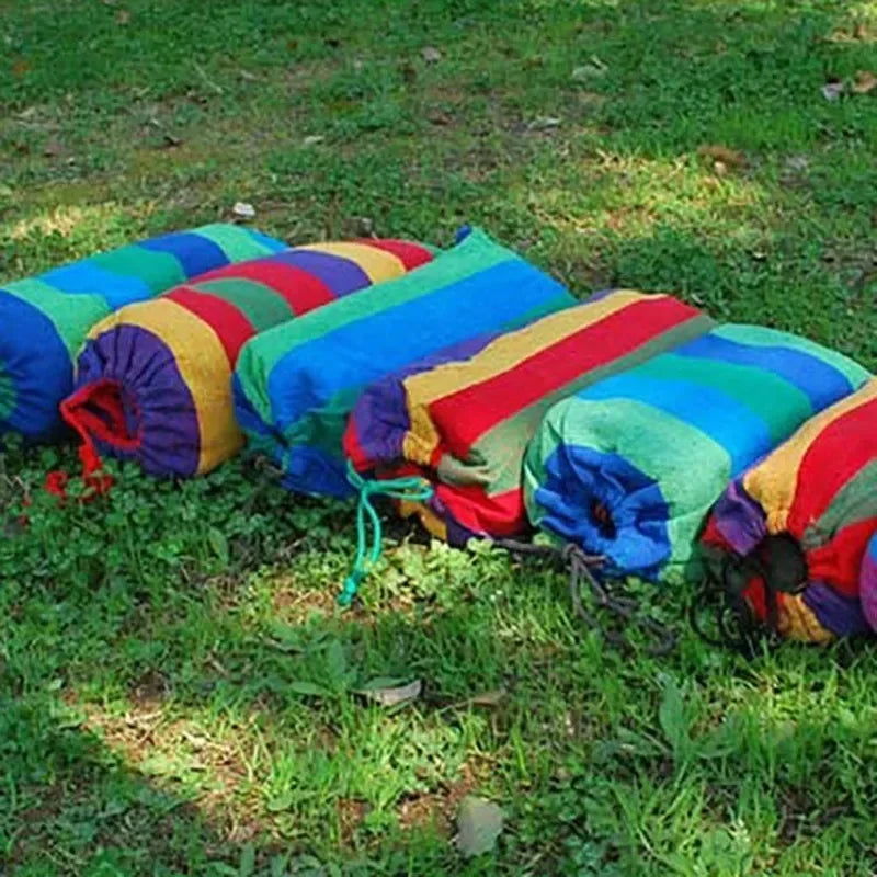 Colorful drawstring bags on a grassy background