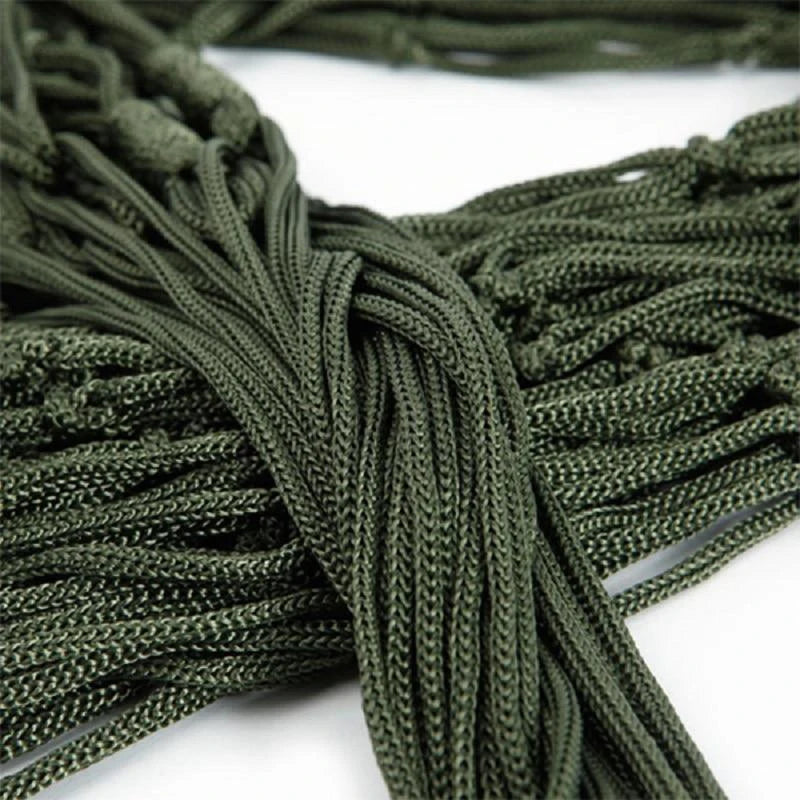 Close-up of green paracord on a white background