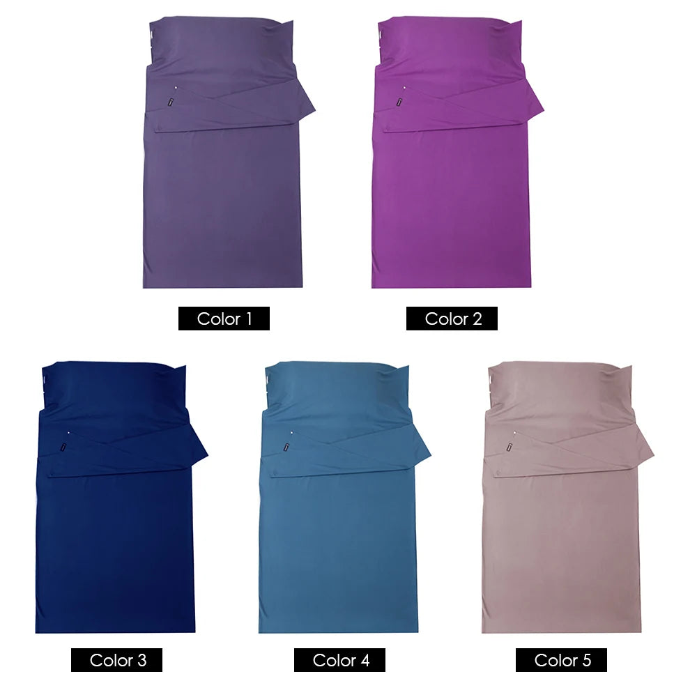 Set of five folded fabrics in different colors on a white background