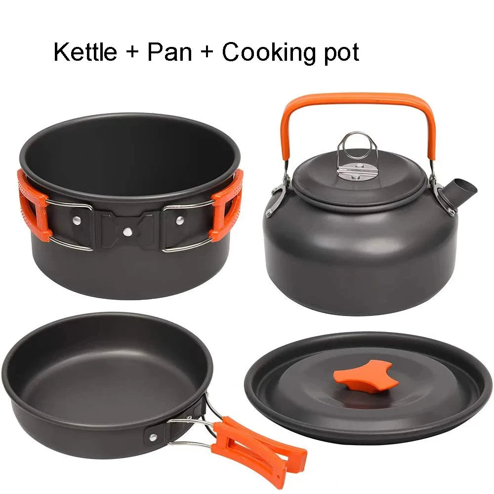 Set of camping cookware including a kettle, pan, and cooking pot with orange handles and accents on a white background.