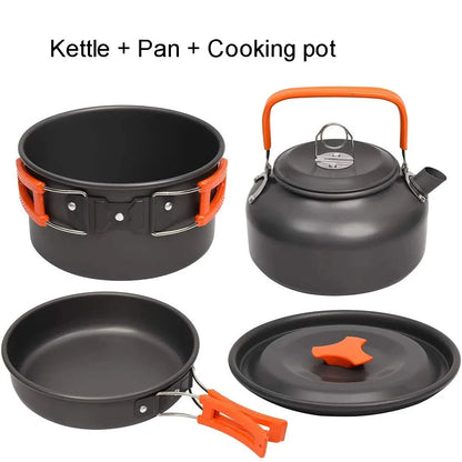 Set of camping cookware including a kettle, pan, and cooking pot with orange handles and accents on a white background.