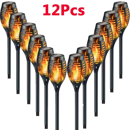 12 solar-powered flame lights on a white background with '12Pcs' text above.