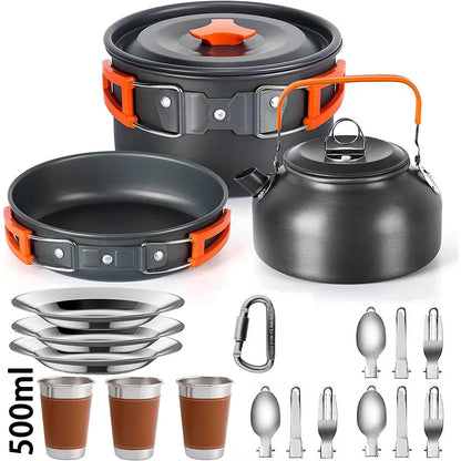 Set of camping cookware including pots, pans, kettle, cups, and utensils on a white background.