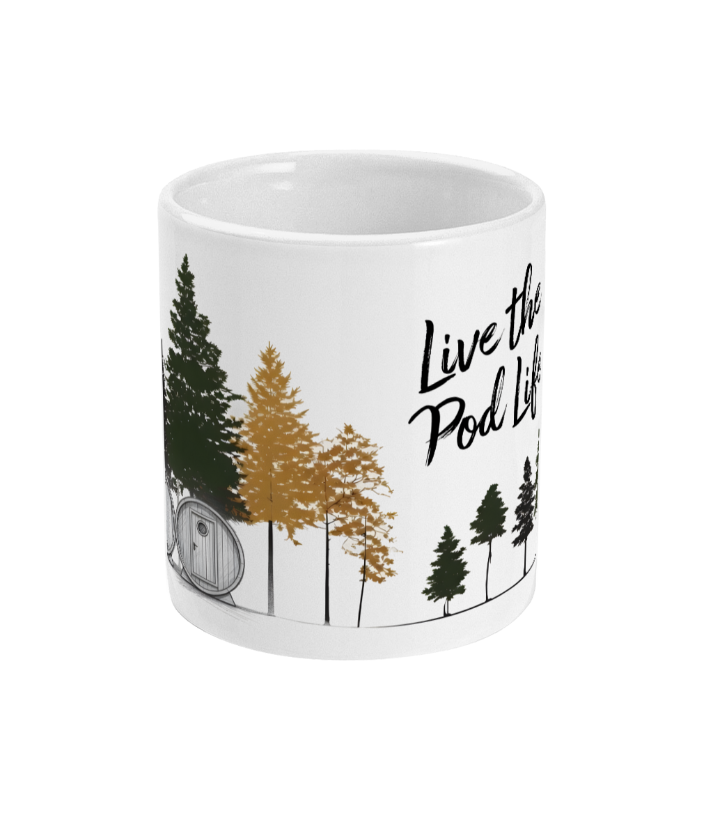 White mug with forest design and 'Live the Pod Life' text on a white background