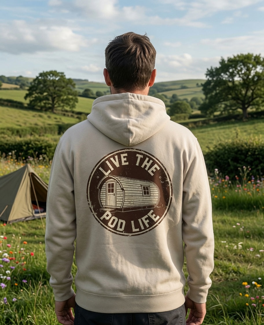 Person wearing a hoodie with 'Live the Pod Life' design in a scenic outdoor setting